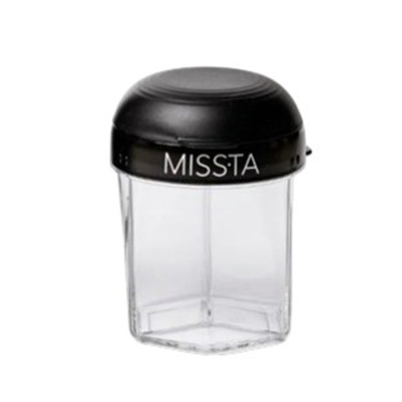 The Missta Formula Dispenser by Missta features a clear, hexagonal design with a black lid. This modern, spill-proof container is ideal for baby feeding and is shown empty against a white background.
