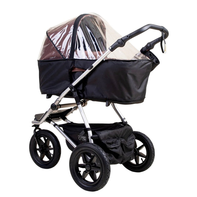 The Mountain Buggy Carrycot Plus Storm Cover for V4 Urban Jungle and Terrain shields the seating area of your black baby stroller with water-resistant protection, large wheels, a storage basket, a curved handle, and carrycot plus compatibility.