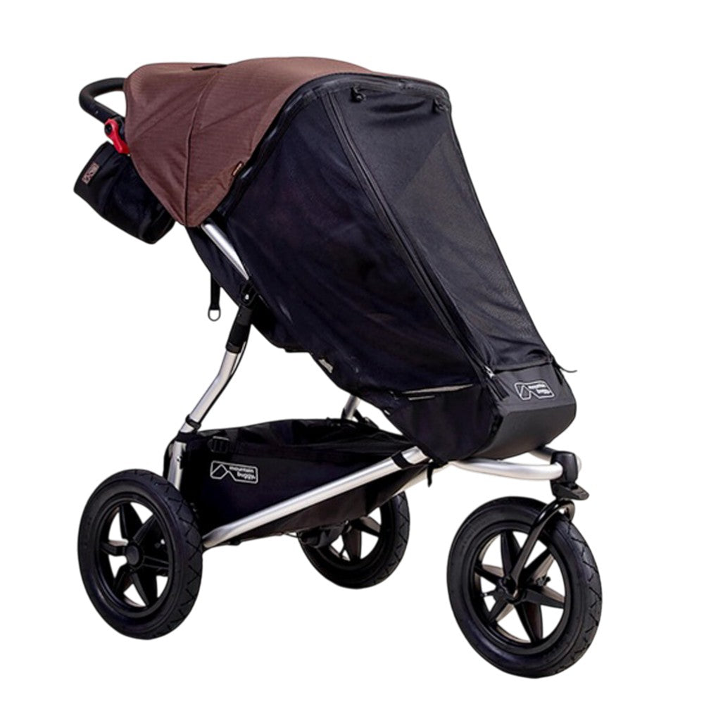 The Mountain Buggy Urban Jungle & Terrain Sun UV Mesh & Blackout Cover Set by Mountain Buggy features a brown UPF 50+ canopy, black mesh, large black wheels, a storage basket underneath, and a handle pouch on this three-wheeled jogging stroller.