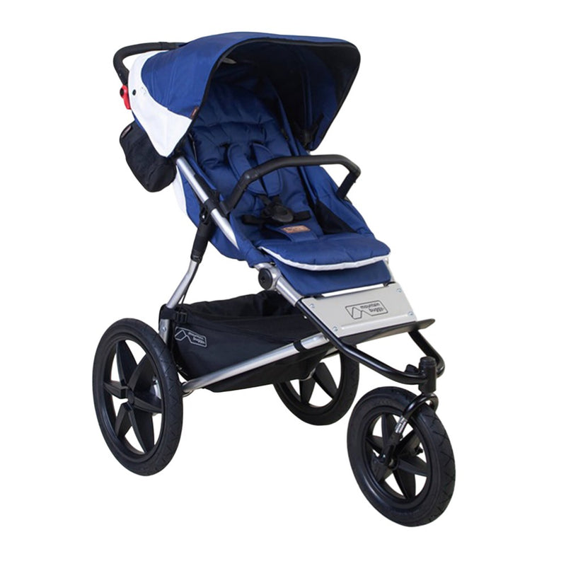 The Mountain Buggy Terrain V4 by Mountain Buggy is a blue and black all-terrain 3-wheel stroller with a canopy, padded seat, front safety bar, and large rubber tires—perfect for outdoor adventures.