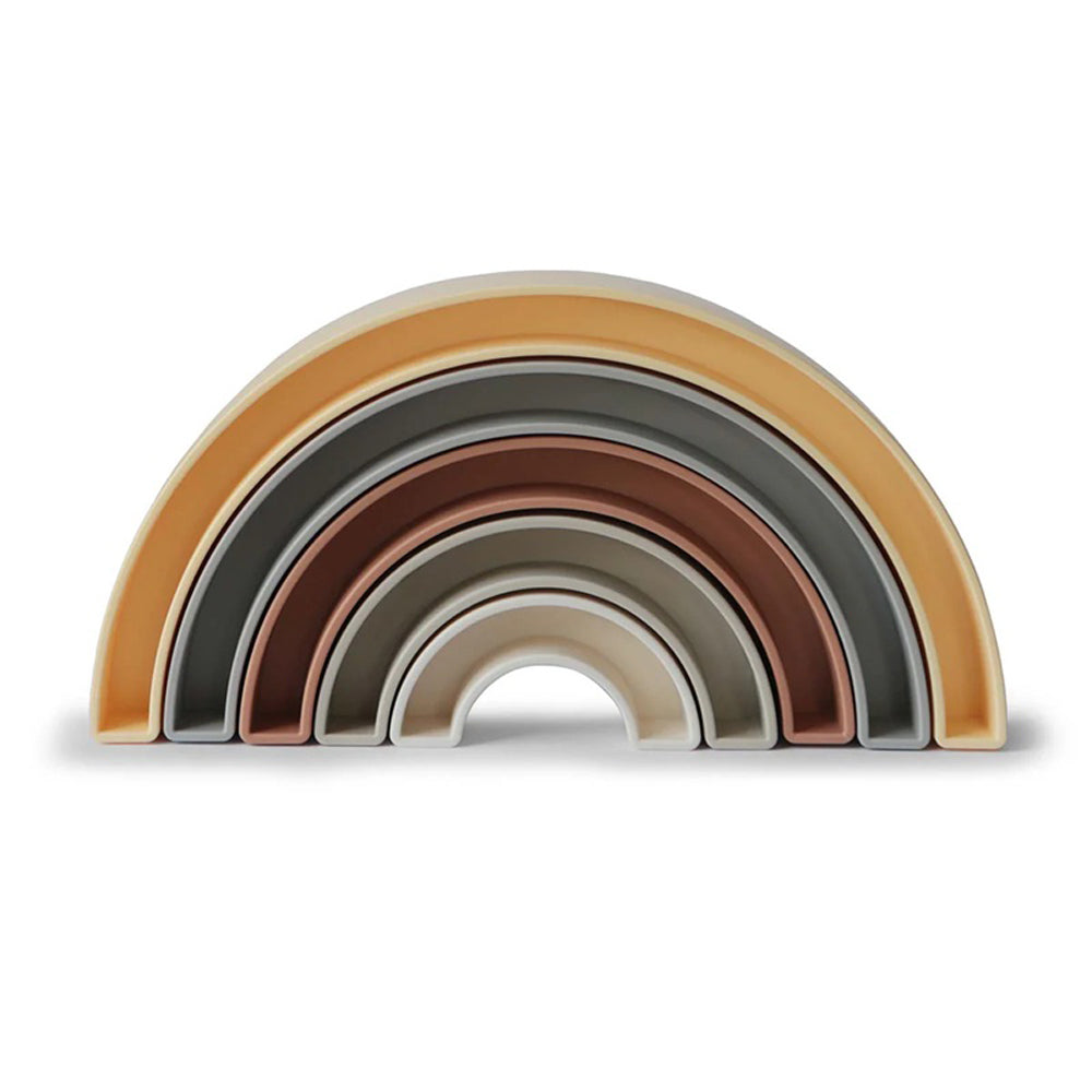 The Mushie Rainbow Stacker by Mushie features semi-circular nesting arches in earthy, neutral tones—ideal for nursery décor and supporting your baby’s fine motor skill development.