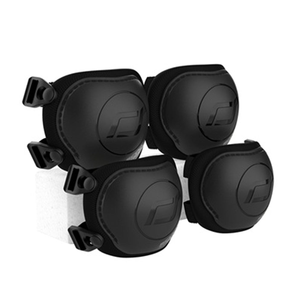 The Scoot and Ride Protective Knee and Elbow Pack (XXS) by Scoot and Ride features four black pads with adjustable straps, arranged in pairs on a white block—designed for skateboarding, cycling, or similar activities.