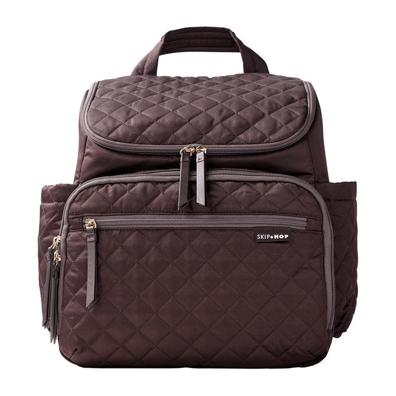 The Skip Hop Forma Nappy Backpack is a quilted dark brown diaper bag with multiple zip compartments, insulated bottle pockets, two side pockets, a top handle, and the Skip Hop logo on the front pocket.