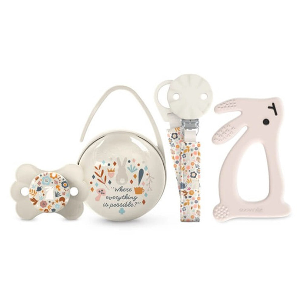 The Suavinex Wonderland Gift Set by Suavinex features a floral pacifier, holder case with “where everything is possible” text, pacifier clip, and pale pink bunny teether—perfect as a newborn gift for any special occasion.
