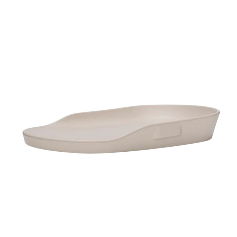The Seena Touzy Change Mat by Seena is a beige, shallow, oval mat with a raised edge on one side and a handle indentation—ideal as a portable changing station.
