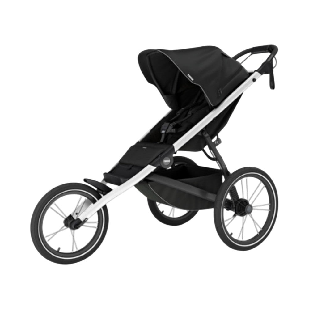 The Thule Glide 3 by Thule is a black and silver jogging stroller featuring an aerodynamic, lightweight design with three wheels, a canopy, large rear wheels, a front swivel wheel, and an underseat storage basket.