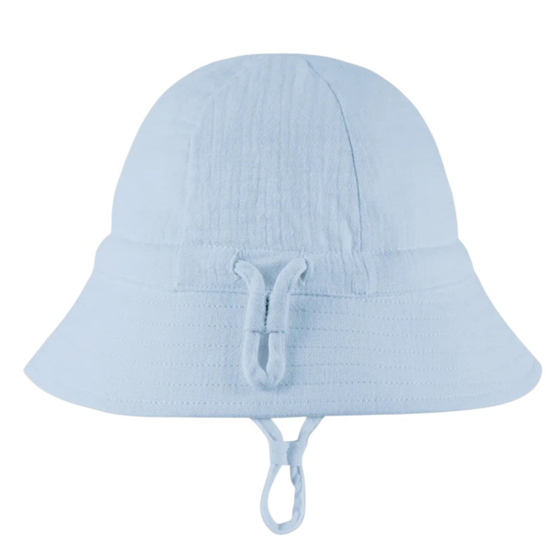 The Toshi Bell Hat Sammy Dusk by Toshi is a light blue organic cotton sunhat with a wide brim, adjustable chin strap, soft-textured design, and UPF 50+ protection, shown on a plain white background.