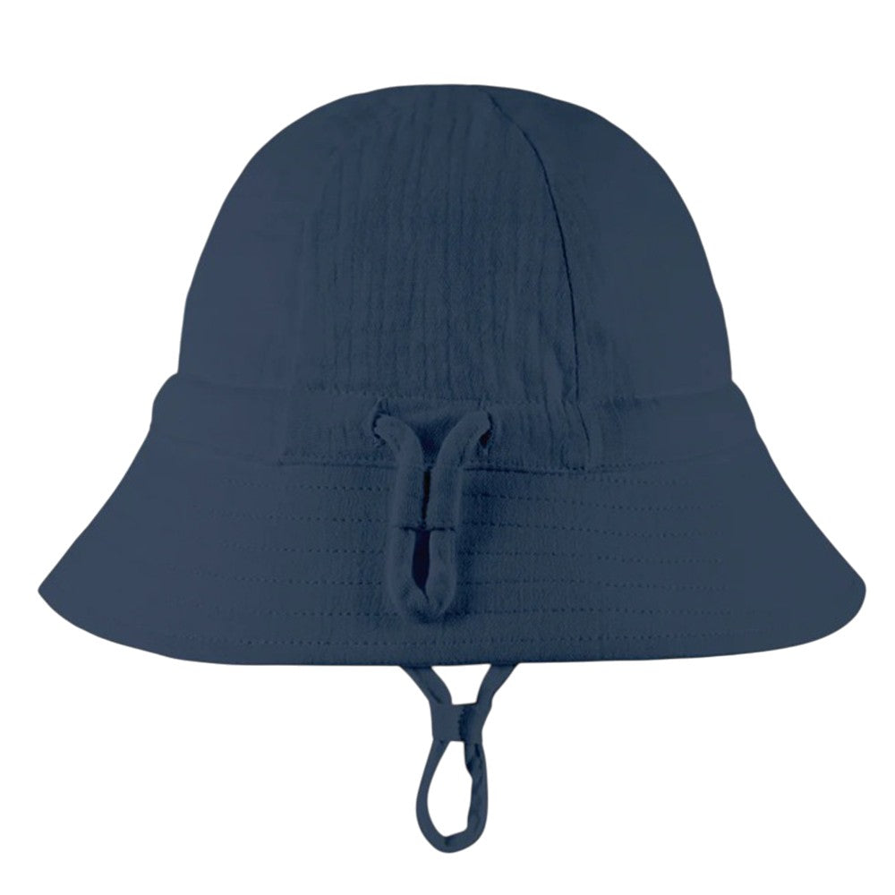 The Toshi Bell Hat Sammy Midnight by Toshi is a navy blue, bell-shaped organic cotton sunhat with a wide brim, adjustable chin strap, stylish front loop detail, textured fabric, and UPF 50+ sun protection.