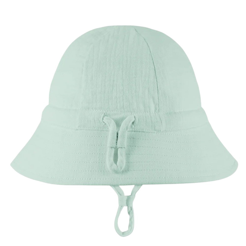The Toshi Bell Hat Sammy Sage by Toshi is a light mint green, bell-shaped sunhat with a wide brim and chin strap, crafted from soft organic cotton—ideal for sunny days.