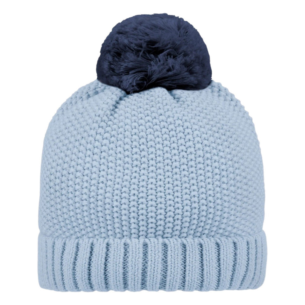 The Toshi Organic Beanie Bobby Bluebell by Toshi is a light blue organic cotton baby beanie with a ribbed fold-over cuff and a large dark blue pom-pom, shown on a white background.