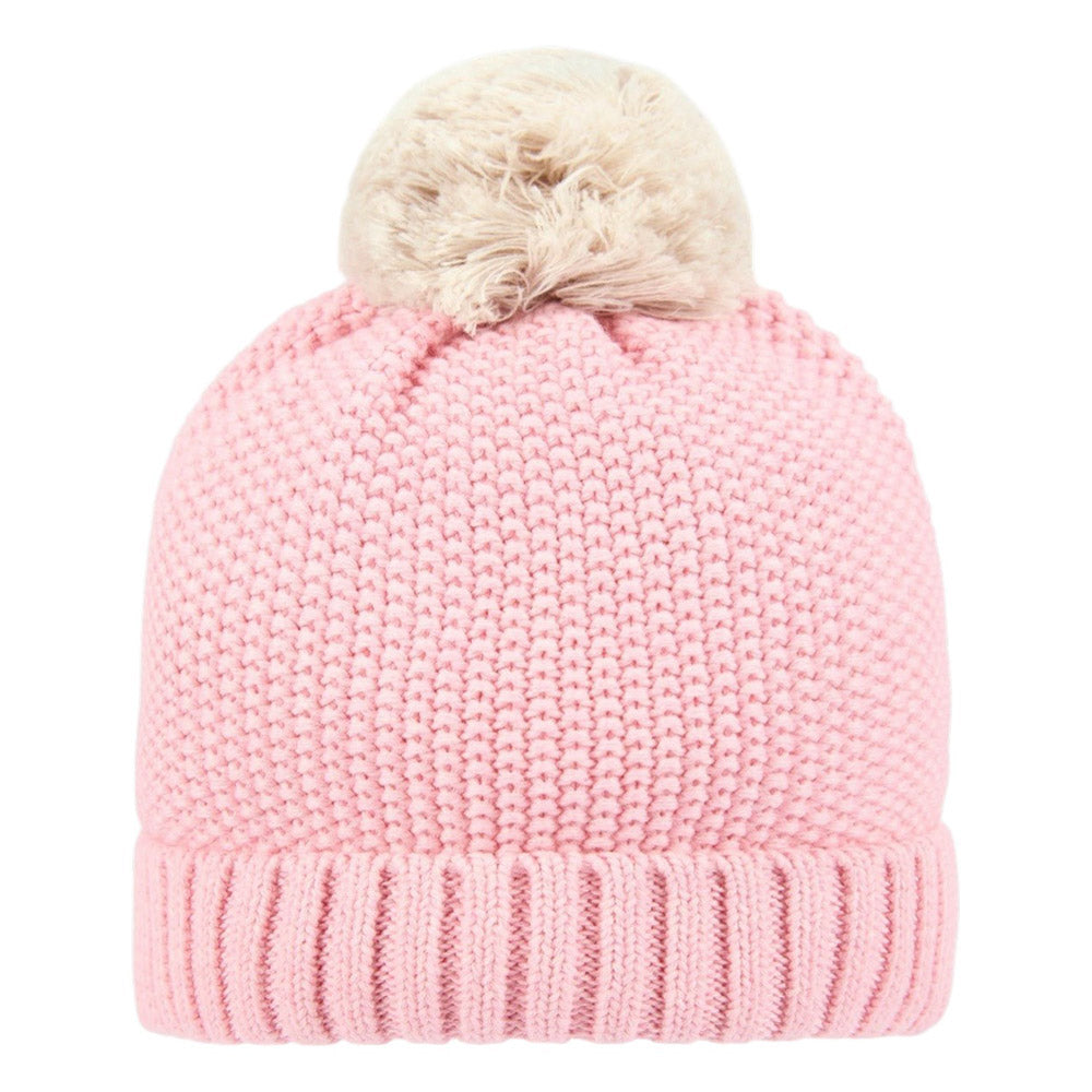 The Toshi Organic Beanie Bobby Misty Rose is a pink organic cotton hat with a wide ribbed brim and a large beige pom-pom on top.