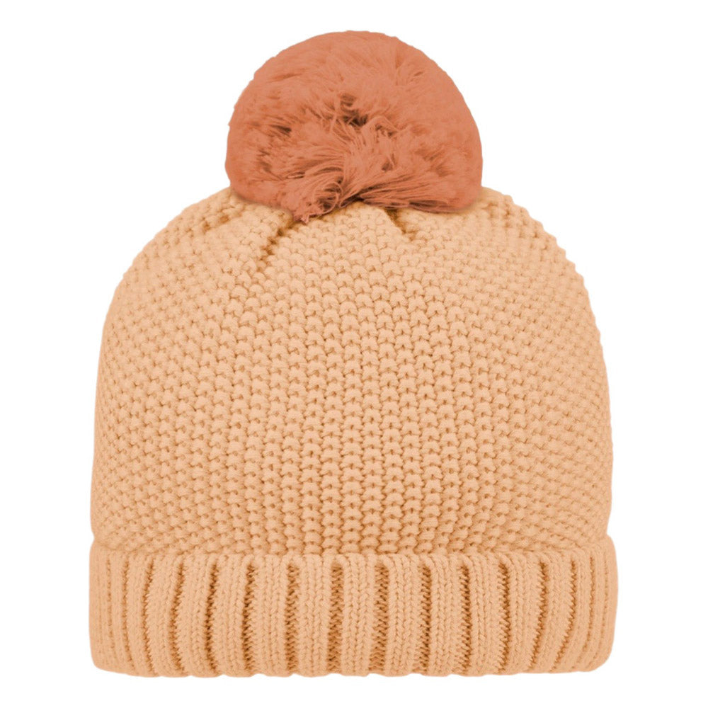 The Toshi Organic Beanie Bobby Oak is a beige beanie by Toshi, crafted from soft organic cotton with a thick ribbed cuff and topped with a large, fluffy light brown pom-pom for warmth and comfort.