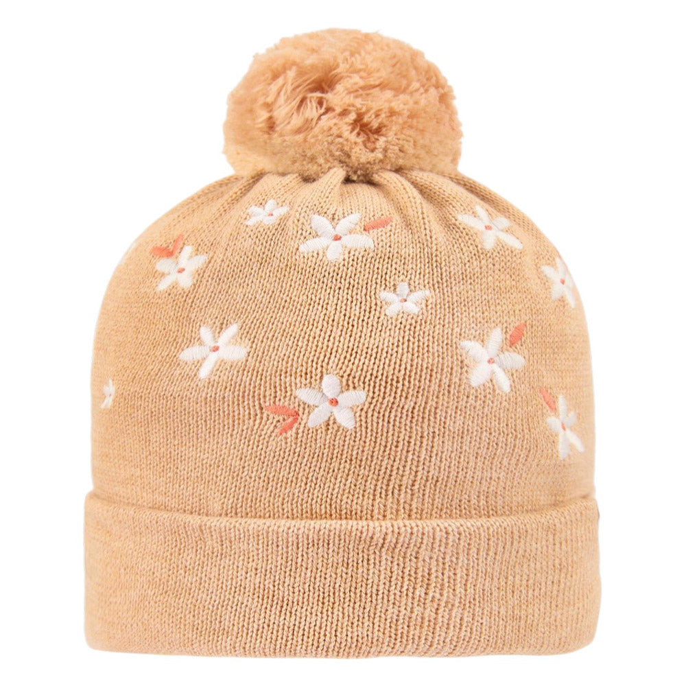 The Toshi Organic Beanie Mystical Jasmine Oak by Toshi is a tan organic cotton beanie with a folded brim, pom-pom on top, and small white embroidered flowers.