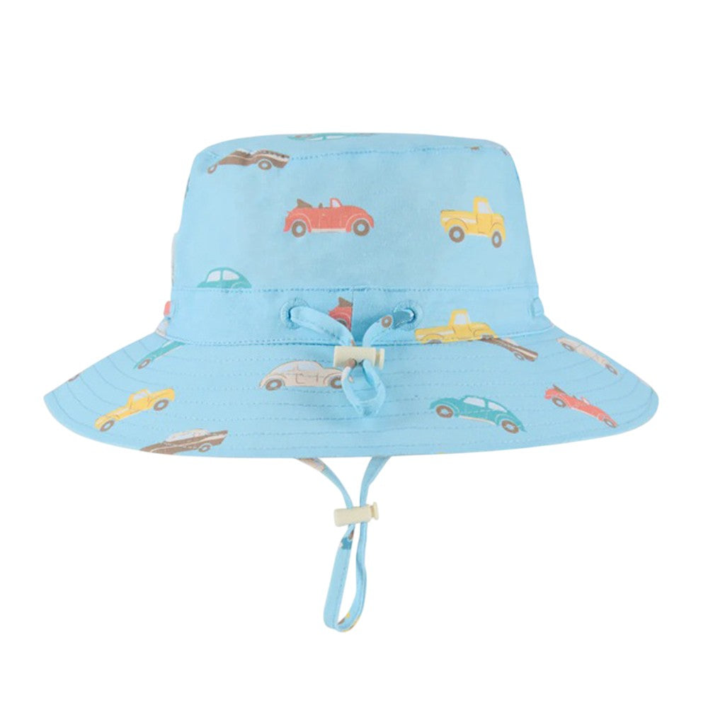 The Toshi Sunhat Ryder Fast Lane Cyan features a light blue wide brim, colorful vintage car print, UPF 50+ UV protection, and an adjustable chin strap with toggles for a comfortable fit.