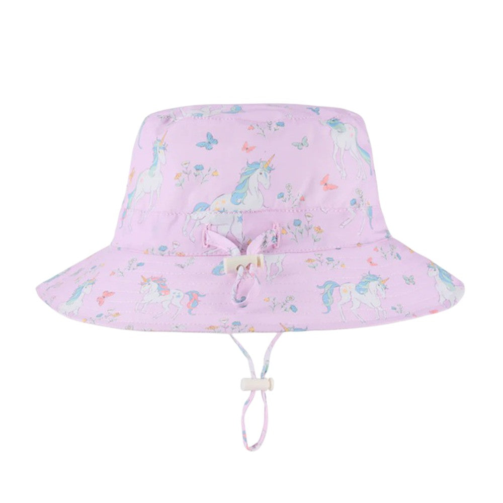 The Toshi Sunhat Spell Unicorn Lilac is a kids' cotton sunhat with UPF 50+ protection, featuring unicorns, butterflies, pastel flowers, a wide brim, adjustable chin strap, and a small front bow—ideal for sunny days.