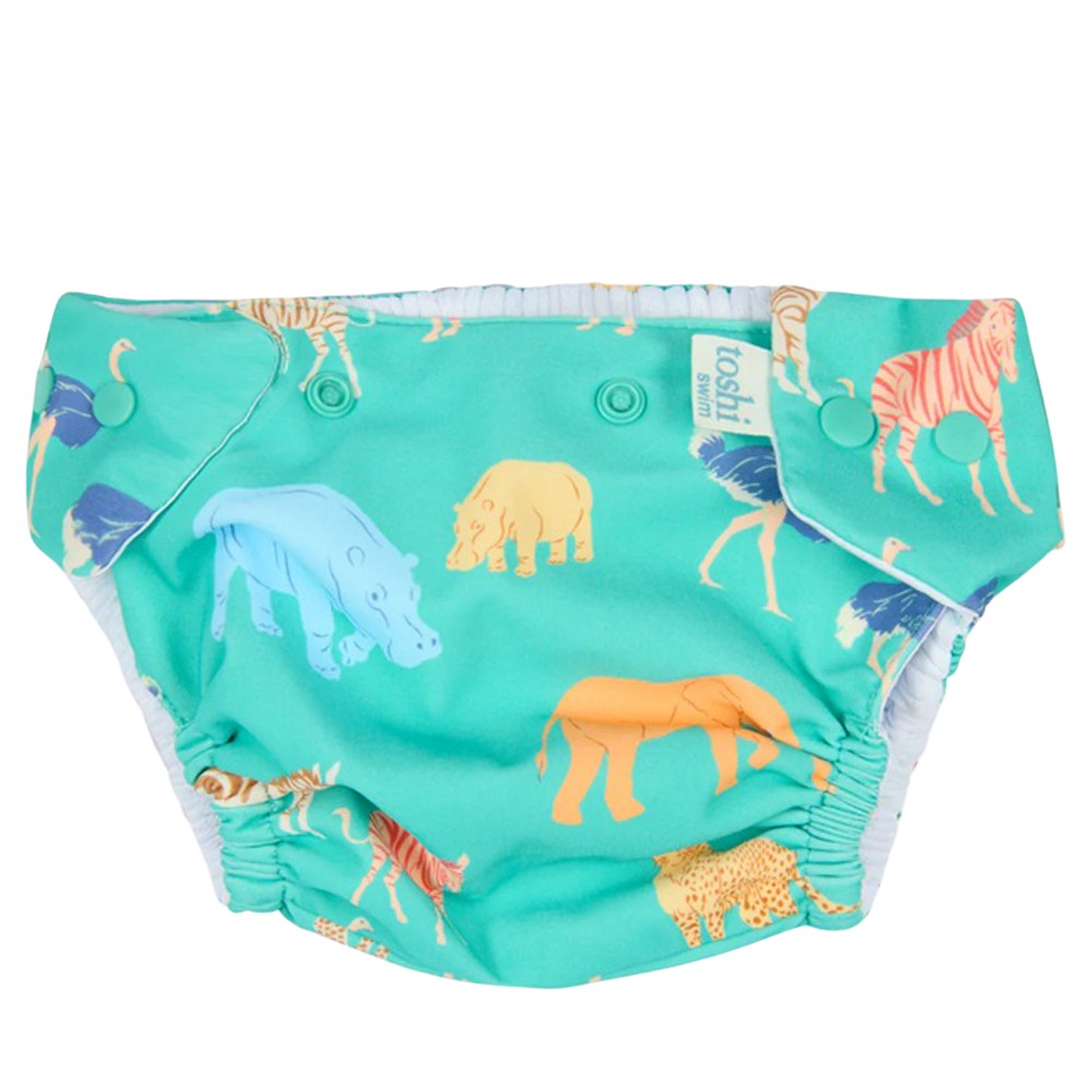 The Toshi Swim Nappy Paradise Congo Seagrass by Toshi features colorful animal prints on teal, side snaps, and elastic leg openings—providing comfort and easy changes for your little one.