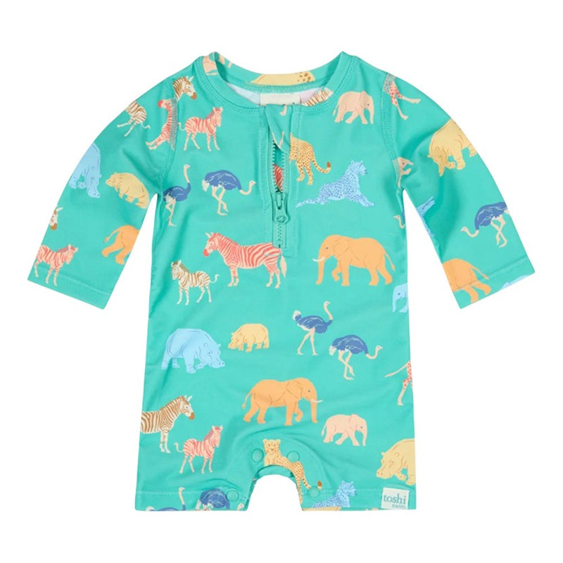 The Toshi Swim Onesie L/S Splash Congo Seagrass is a long-sleeve baby romper in teal with colorful animal prints and front buttons. Designed as swimwear, it offers UPF 50+ sun protection for outdoor adventures.