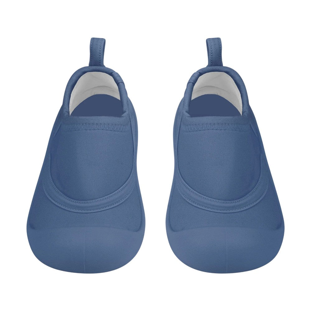 The Toshi Swim Reef Booties Beachcomber Moonlight by Toshi are blue neoprene baby shoes with rounded toes, back pull tabs, and UPF 50+ protection, shown from above on a white background.