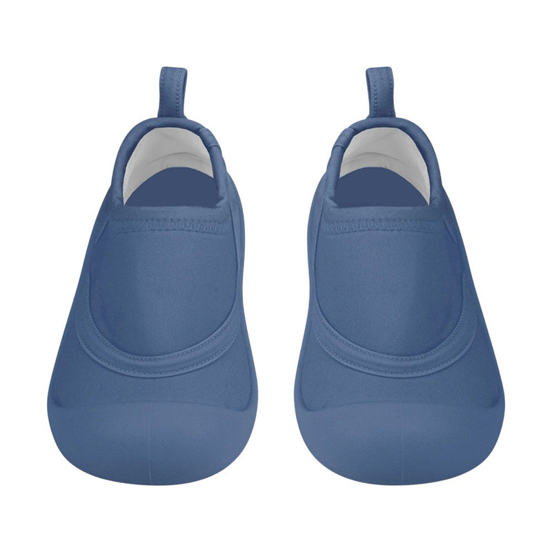 The Toshi Swim Reef Booties Beachcomber Moonlight by Toshi are blue neoprene baby shoes with rounded toes, back pull tabs, and UPF 50+ protection, shown from above on a white background.