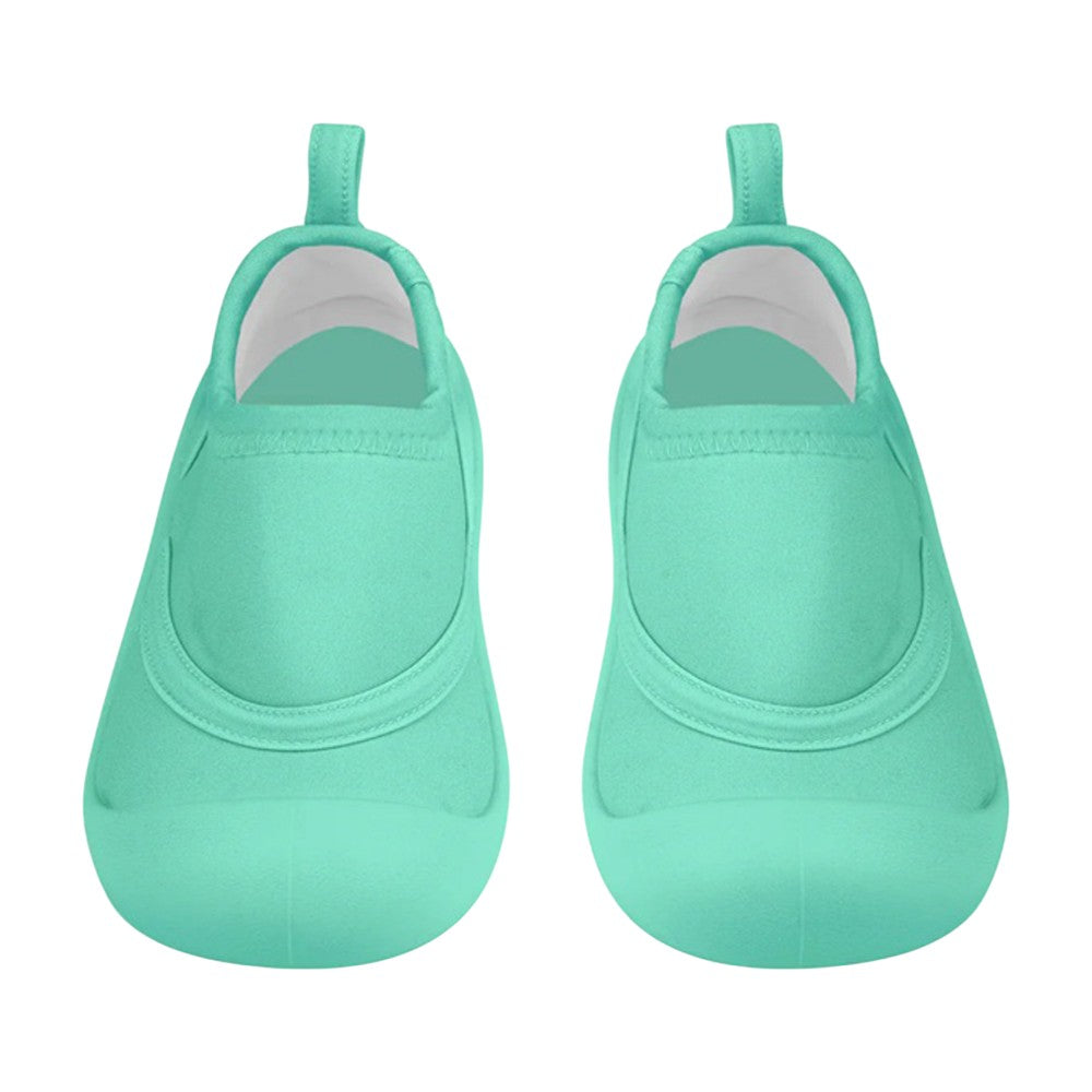 A pair of Toshi Swim Reef Booties Beachcomber Seagrass by Toshi, featuring aqua neoprene, rounded toes, and back pull tabs, displayed from above on a white background.