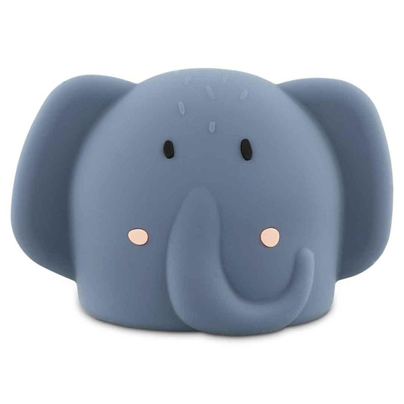 The Trixie Night Light Mrs Elephant by Trixie is a cute blue silicone night light, designed in a cartoon-style elephant shape with large ears, a curved trunk, small black eyes, and pink cheeks.