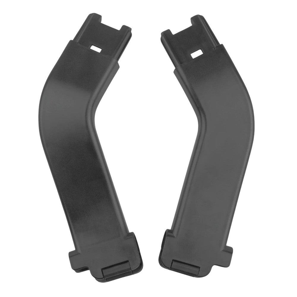 Two black, curved plastic objects sit side by side, each with a rectangular slot and wide base—these are UPPAbaby Minu Duo MESA adapters, made by UPPAbaby for attaching your Mesa infant car seat to the Minu Duo stroller.