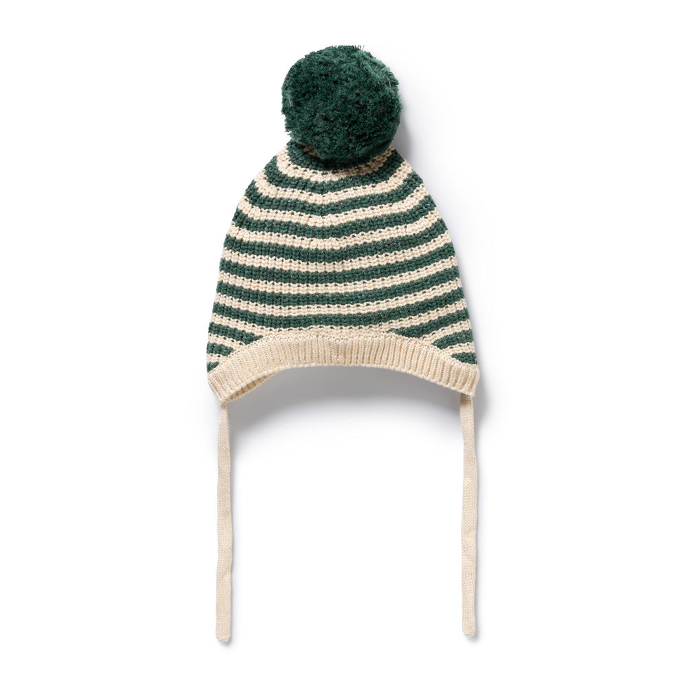The Wilson & Frenchy Clover Organic Knitted Stripe Bonnet features green and white stripes, a large green pom-pom, and two cream-colored ties—perfect for keeping your baby cozy and warm all winter long.