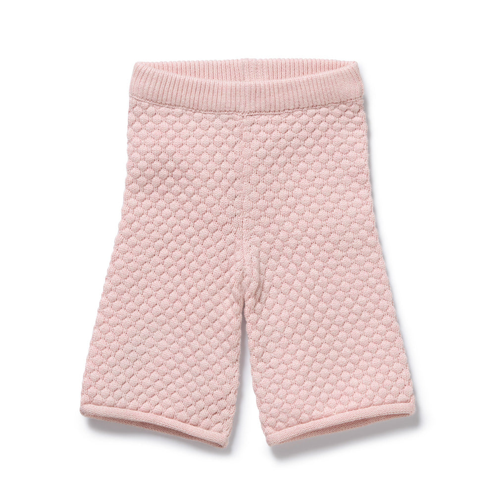 The Wilson & Frenchy Marshmallow Organic Knitted Bubble Pant is a light pink cotton short for babies or toddlers, with a ribbed elastic waistband and honeycomb knit pattern, shown flat on a white background.