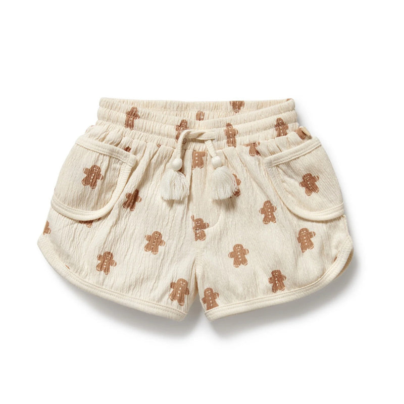 Wilson & Frenchy Spice & Nice Organic Crinkle Short: cream-colored organic cotton shorts with elastic waist, tassel drawstrings, front pockets, and brown gingerbread print—ideal for festive holiday outfits.
