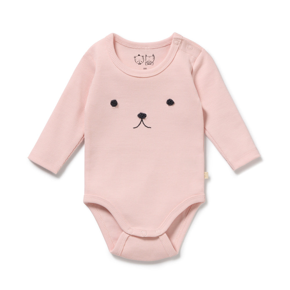 The Wilson & Frenchy Strawberry Cream Organic Rib Long Sleeved Bodysuit features a light pink color, cute animal face embroidery, snap buttons on one shoulder, and a snap crotch for easy changing.