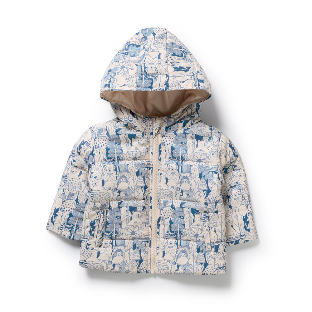 The Wilson & Frenchy Woodland Adventures Puffer Jacket is a kids’ zip-front, hooded jacket made from recycled polyester, featuring a blue and white woodland animal and plant print on a light background.