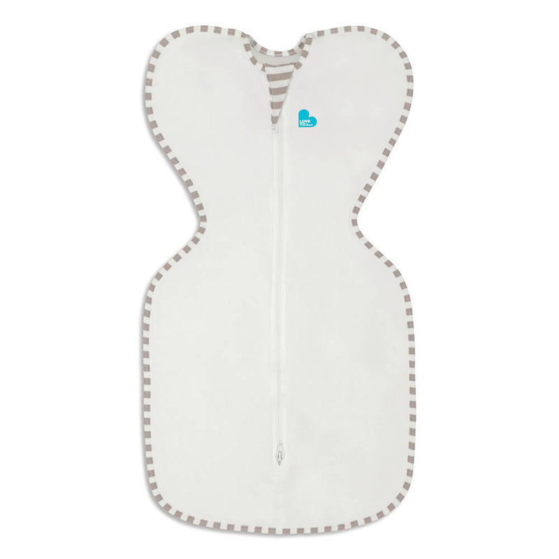 The Love To Dream Swaddle UP Organic 1.0 Tog is a white zip-up swaddle with taupe-striped trim, turquoise heart logo, and winged ARMS UP™ design. Made from organic cotton for a snug fit. Brand: Love To Dream.