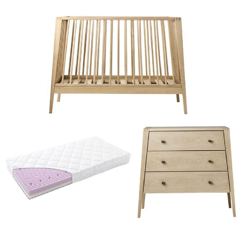 The Leander Linea Cot + Leander Mattress + Linea Dresser set from Leander features a slatted cot, three-drawer dresser, and a mattress with a quilted white cover and visible purple foam layer.