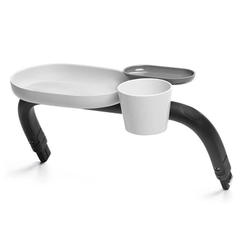 The Cybex Gazelle Snack Tray by Cybex features a detachable white plate, matching cup, and gray tray on black arms—ideal for snacks on the go and easy to clean after each use.