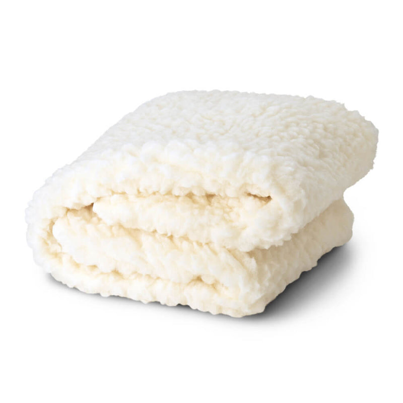 The BabyRest Lambswool Portacot Underlay by BabyRest is a soft, cream-colored, textured layer—ideal for asthma and allergy-friendly comfort on your portacot mattress.