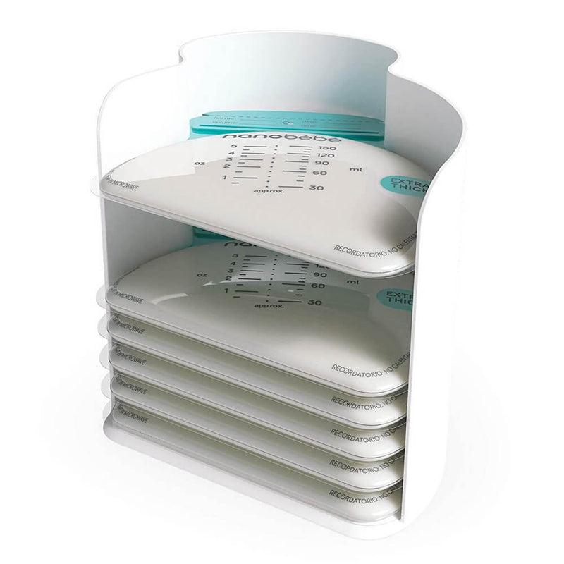 A vertical white Nanobebe Breastmilk Organiser holds a stack of transparent Nanobebe breastmilk storage bags with measurement markings. The top leak-proof bag is partially filled; the others are empty. Brand name "Nanobebe" is visible. Pack contains 25 bags.