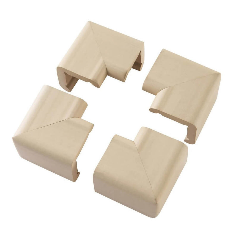 Four beige ClevaMama X-Large Corner Cushions by Clevamama are arranged in a square on a white background, designed to baby-proof sharp furniture edges for added child safety; pack includes 4 cushioned corners.