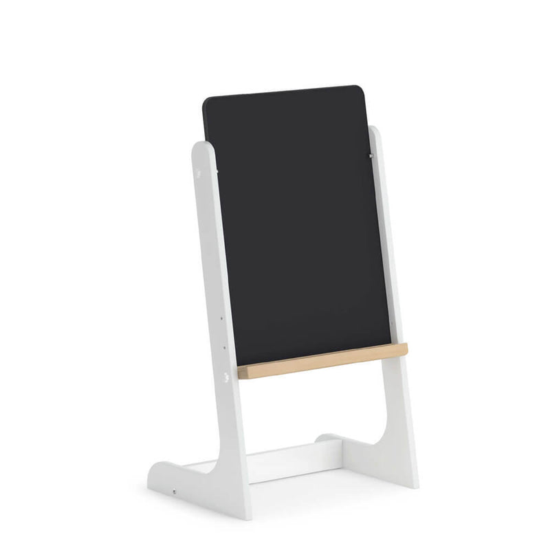 The Boori Tidy Magnetic Drawing Board by Boori is a freestanding white-framed children’s whiteboard with a black writing surface and a light wooden tray at the bottom, shown against a plain white background.