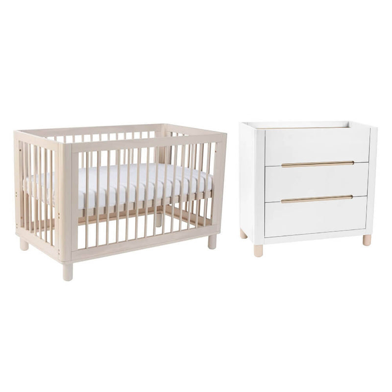 A Cocoon Allure Cot and matching Change Table by Cocoon, both made from sustainable New Zealand pine, stand side by side against a plain white background.