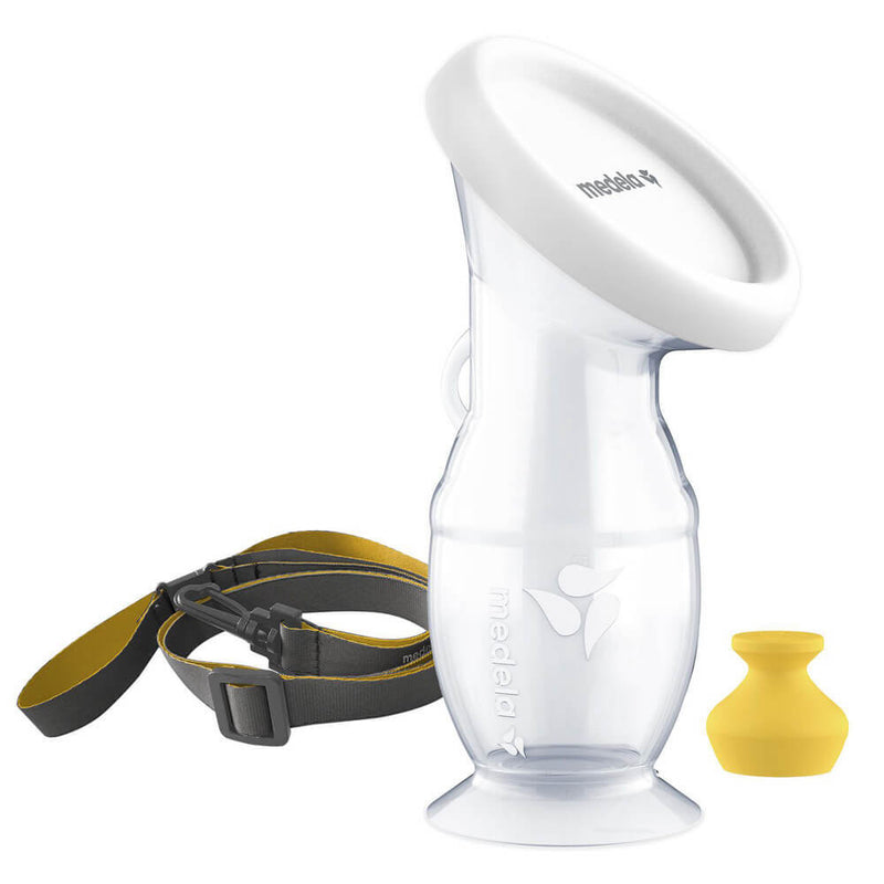 The Medela Silicone Breast Milk Collector, featuring a white rim, yellow stopper, and black-and-yellow lanyard, is shown on a white background—an ideal leakproof breastfeeding companion.