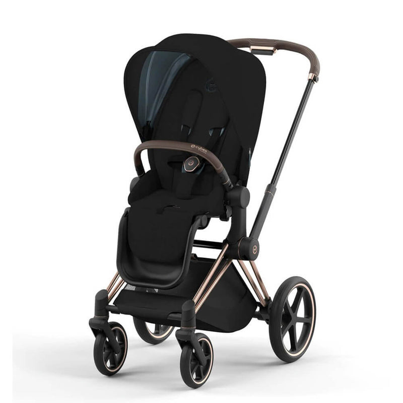 The Cybex Priam Pram by Cybex is a modern black stroller with a padded seat, safety harness, brown handlebar, and large wheels—part of a versatile 4-in-1 Travel System—shown on a white background.