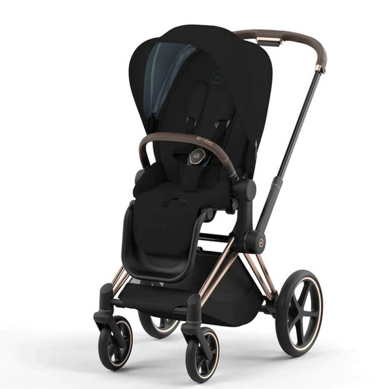 The Cybex ePriam Pram is a modern black stroller with a sunshade canopy, safety harness, large wheels, metallic frame accents, spacious seat, and hands-free rocking for added convenience.