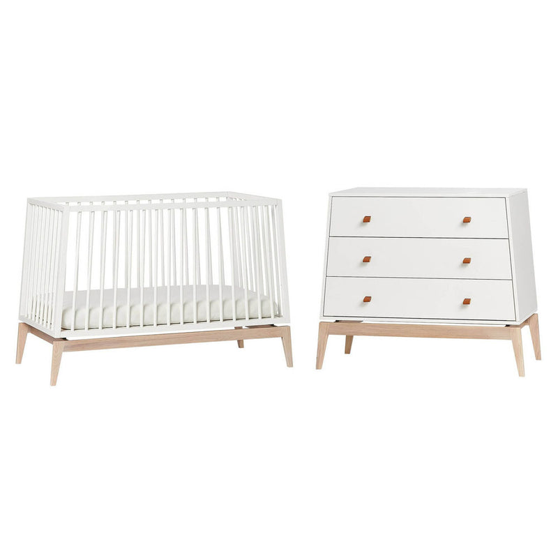 The Leander Luna Cot + Dresser by Leander features a modern, minimalist design with light wood accents—ideal for stylish nurseries seeking contemporary furniture.