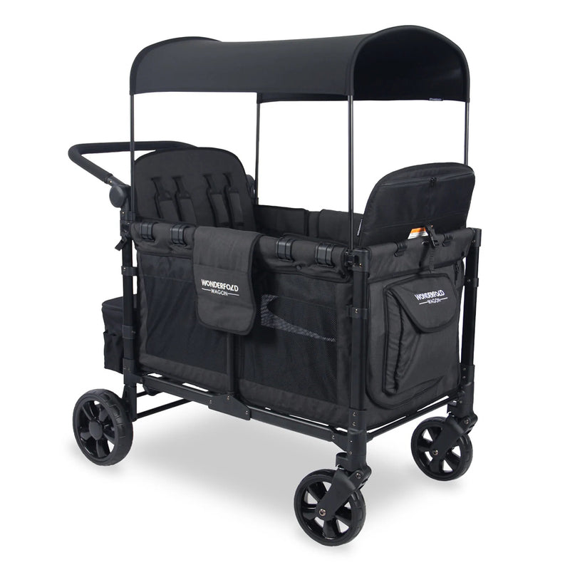 The Wonderfold W4 Elite Quad Wagon is a black folding stroller wagon for kids, featuring four wheels, canopy, side storage pockets, two seats with harnesses, and a rear push handle for easy transport.