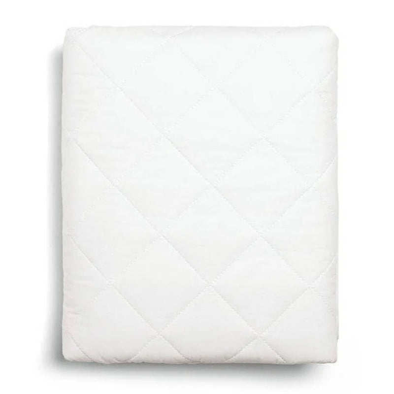 The Mamas & Papas Lua Bedside Bassinet Mattress Protector, a white quilted cover with a diamond pattern, is neatly folded and displayed on a plain white background.