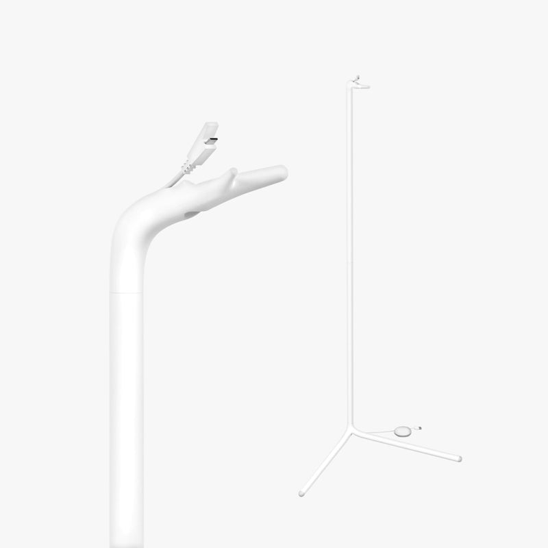 The Lollipop Floor Stand by Lollipop features a minimalist white design with a clamp on a curved arm and tripod base, ideal for mounting the Lollipop Baby Monitor. Its sleek, modern look stands out against a plain white background.