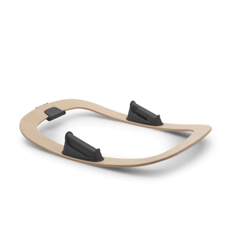 The Bugaboo Giraffe Rocker Frame by Bugaboo is a lightweight, wooden balance board with a curved, oval design and three black rubber grips on top for stability—offering portable versatility and reliable support.