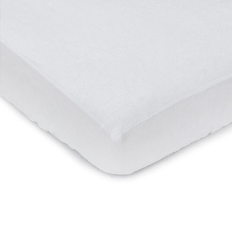 Close-up of the corner of a white mattress fitted with the Bubba Blue Bamboo Mattress Protector by Bubba Blue, shown against a plain white background.