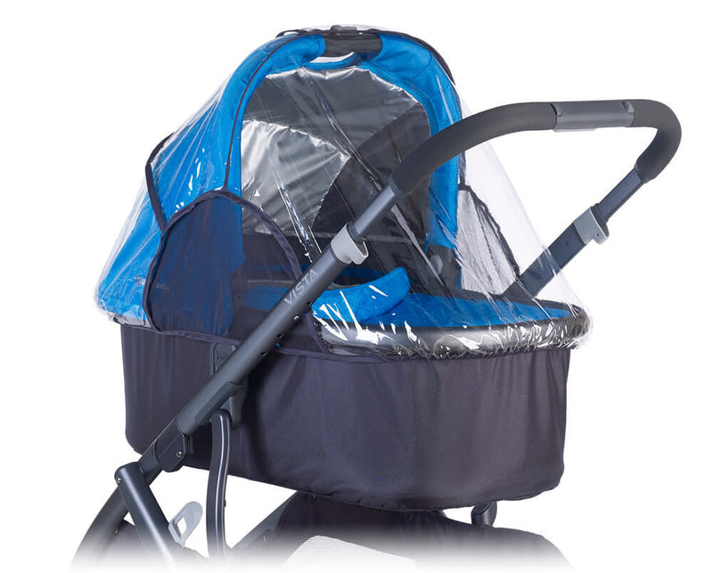 A blue and black baby stroller with the UPPAbaby Bassinet Rain Shield by UPPAbaby protecting the seating area, shown on a white background.